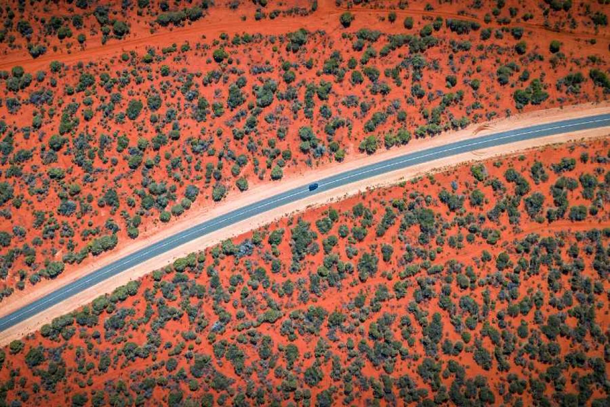 car driving on remote road in Australian outback